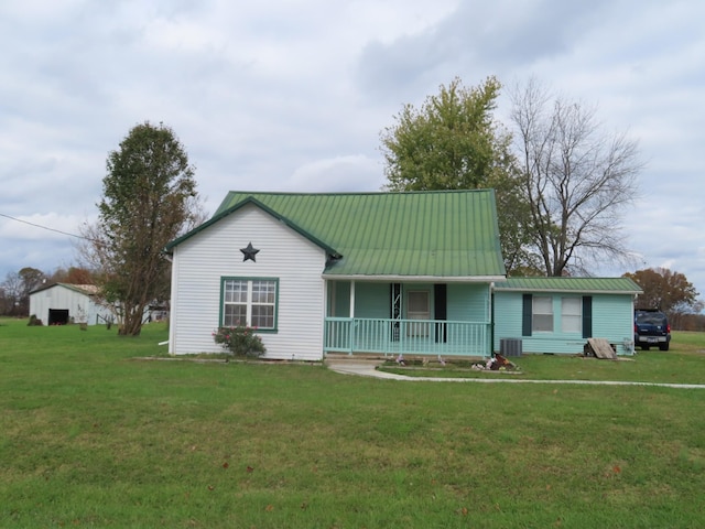 view of front of home with a porch, a front lawn, and central air condition unit