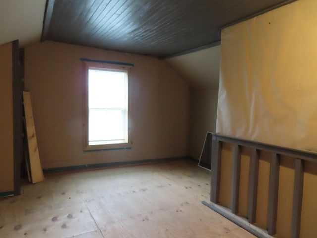 bonus room featuring lofted ceiling