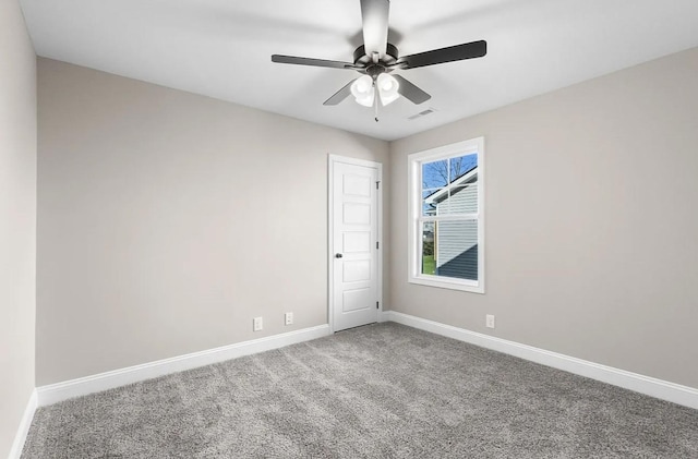 empty room with ceiling fan and carpet flooring