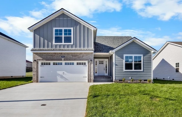 view of front of property with a garage and a front yard