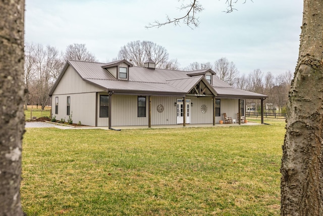 exterior space featuring a lawn and covered porch