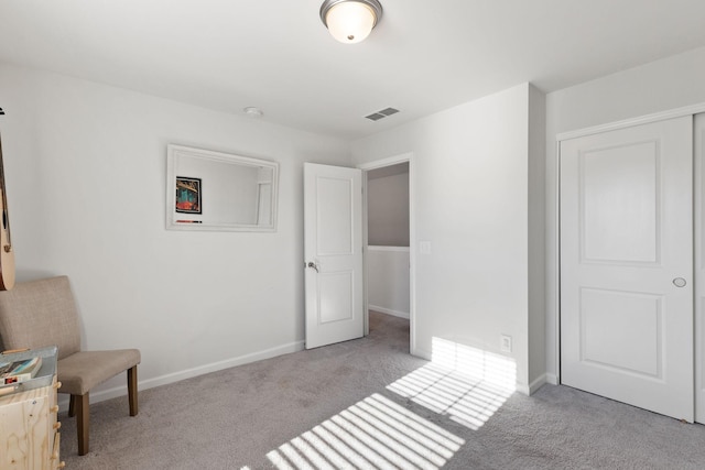 unfurnished bedroom with light colored carpet