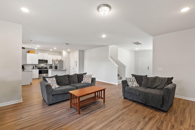 living room with light hardwood / wood-style flooring