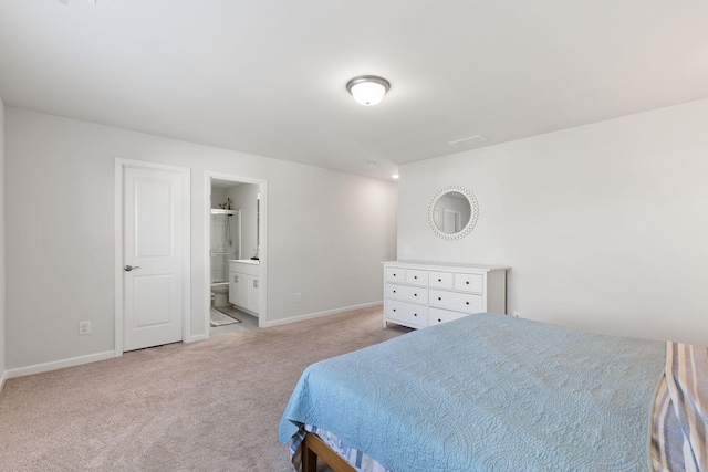 carpeted bedroom with ensuite bathroom