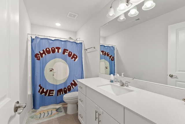 bathroom featuring vanity, walk in shower, tile patterned floors, and toilet