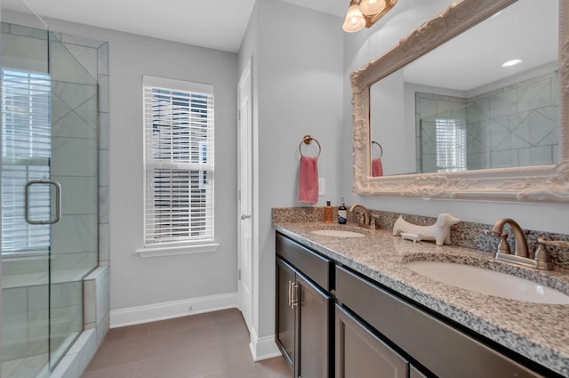 bathroom with vanity and an enclosed shower