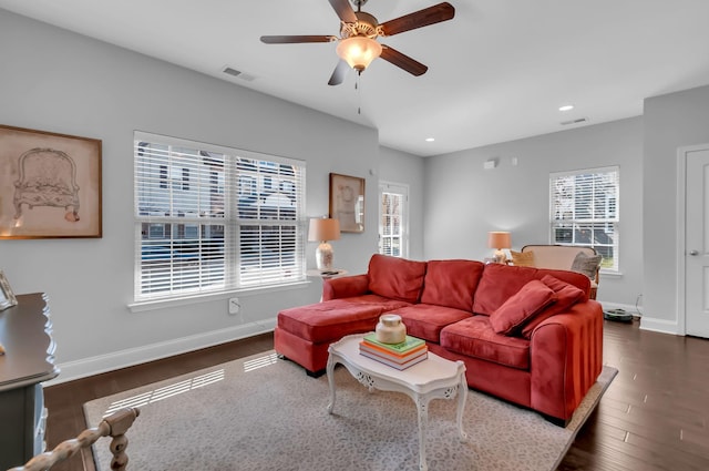 living room with dark hardwood / wood-style floors and ceiling fan