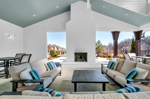 view of patio / terrace with an outdoor living space with a fireplace