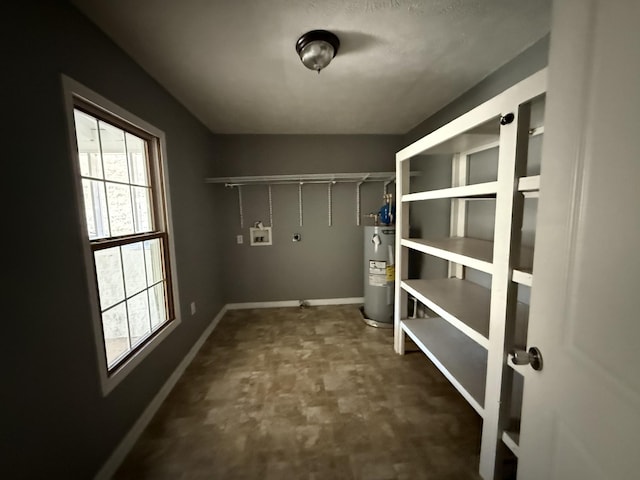 laundry room featuring washer hookup and water heater