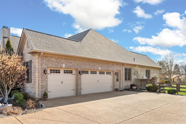 view of side of property with a garage