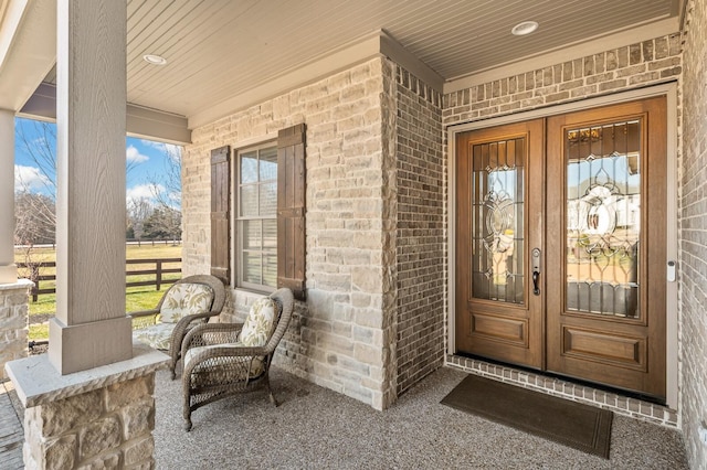 view of exterior entry featuring french doors