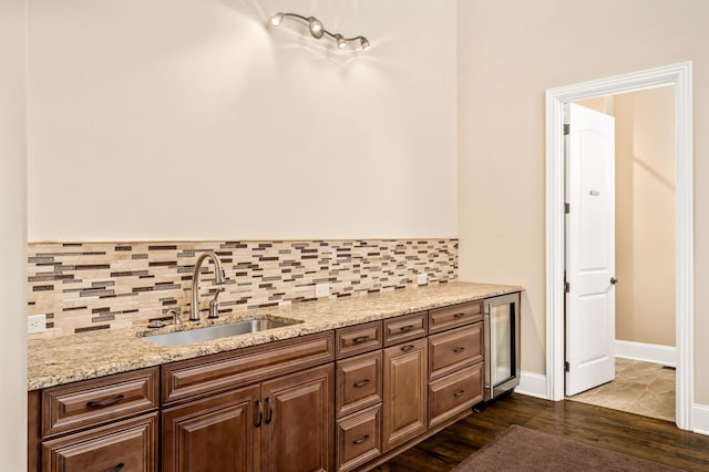 bathroom featuring vanity, wine cooler, hardwood / wood-style floors, and backsplash