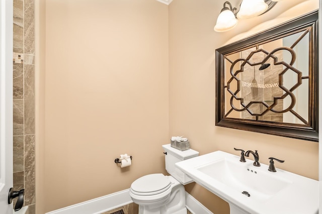 bathroom featuring toilet and sink