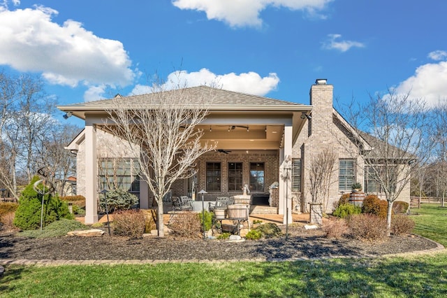 back of property with a patio and ceiling fan