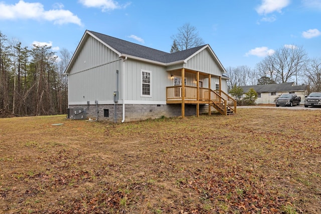 view of home's exterior featuring a lawn and a porch