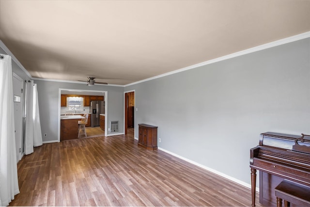 living room with ornamental molding and hardwood / wood-style floors