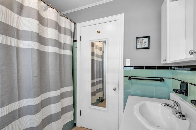 bathroom with tile walls, vanity, and ornamental molding