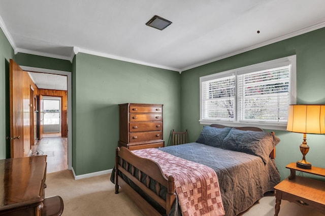 bedroom with crown molding and light carpet