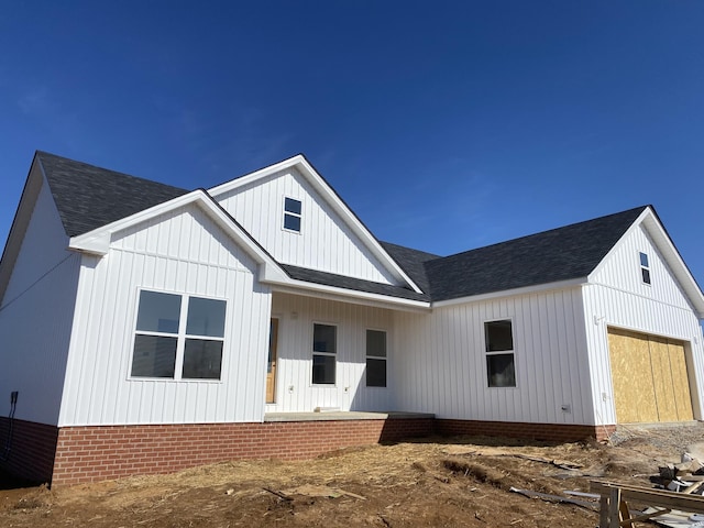 modern farmhouse style home with a garage