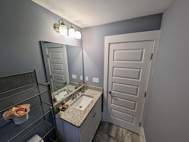 bathroom featuring vanity and wood-type flooring