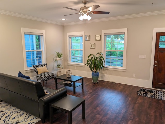 living room with crown molding, wood-type flooring, and ceiling fan