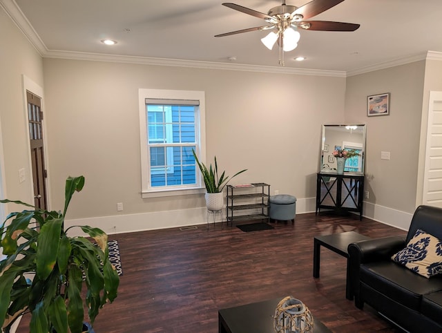 living room featuring dark wood-type flooring, ceiling fan, and crown molding