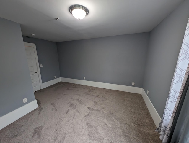 empty room featuring carpet flooring