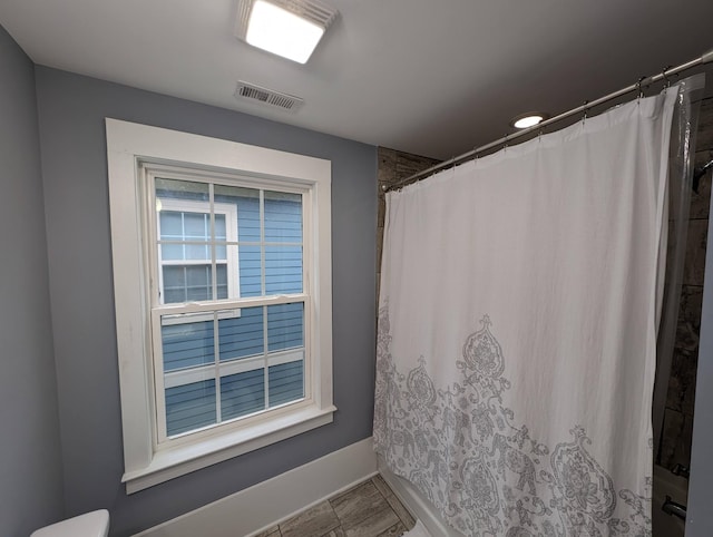 bathroom featuring walk in shower