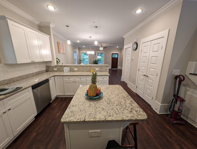 kitchen featuring pendant lighting, white cabinetry, dishwasher, a center island, and kitchen peninsula