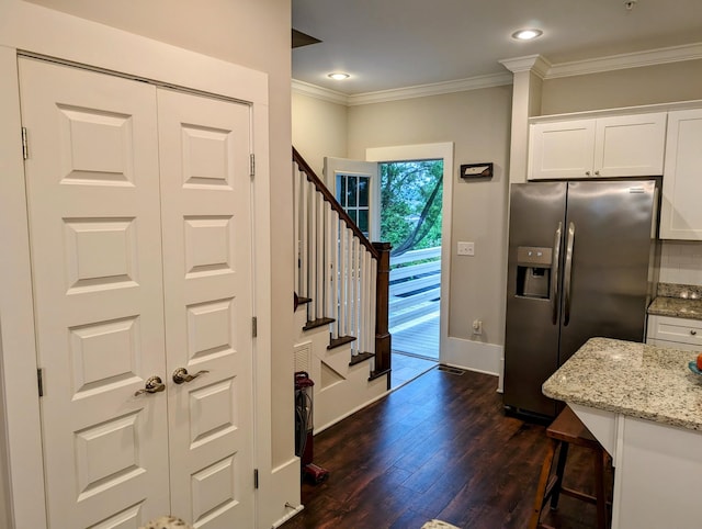 interior space featuring crown molding and dark hardwood / wood-style floors