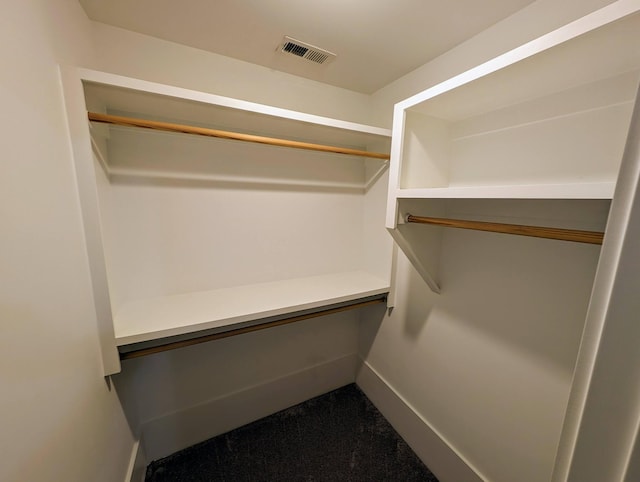 walk in closet featuring built in desk