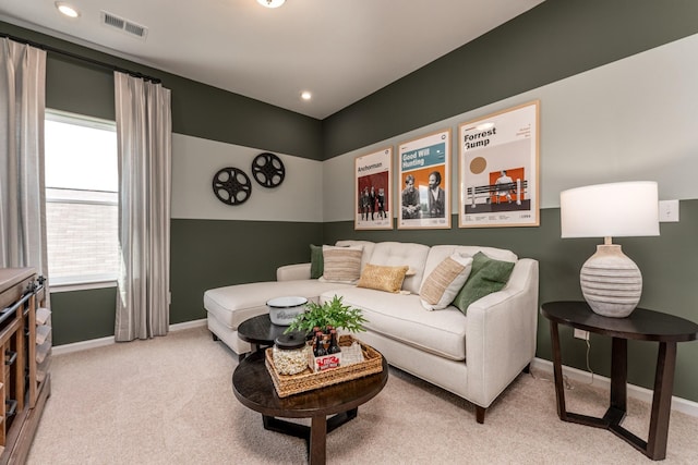 living area featuring recessed lighting, visible vents, light carpet, and baseboards