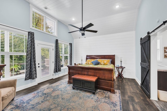 bedroom with wooden walls, high vaulted ceiling, dark hardwood / wood-style flooring, access to outside, and a barn door