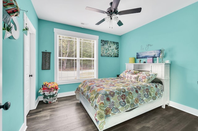 bedroom with dark wood-type flooring and ceiling fan