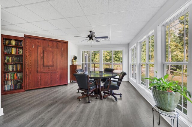 sunroom featuring ceiling fan and a paneled ceiling