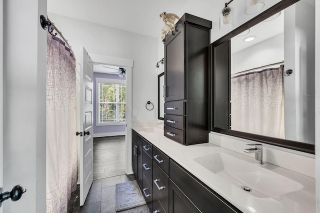 bathroom featuring vanity and ceiling fan