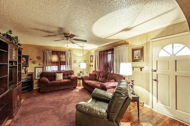 living room featuring crown molding, a healthy amount of sunlight, and hardwood / wood-style flooring