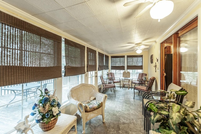 sunroom / solarium featuring vaulted ceiling and ceiling fan