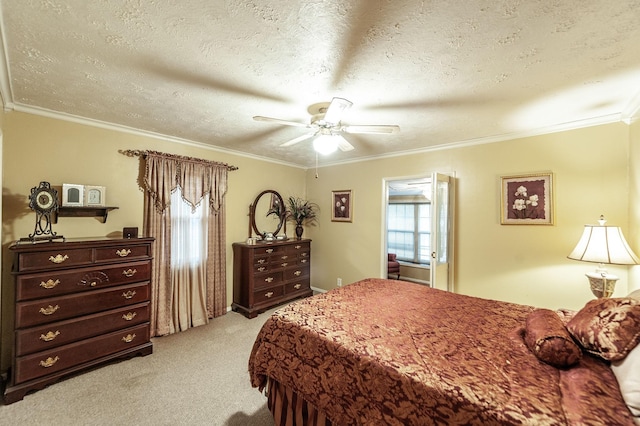 bedroom featuring crown molding, light colored carpet, and a textured ceiling