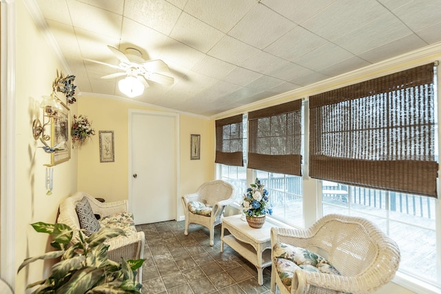 sunroom with ceiling fan