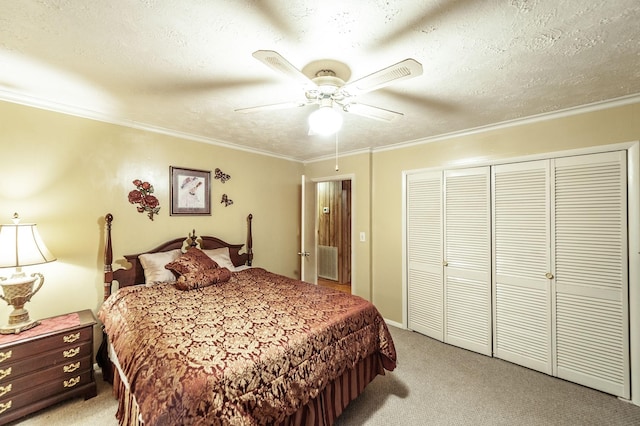 bedroom with ornamental molding, light carpet, a textured ceiling, and a closet