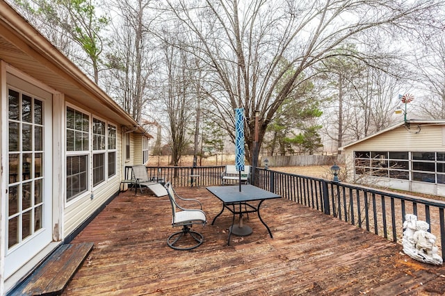 deck with an outbuilding and a garage