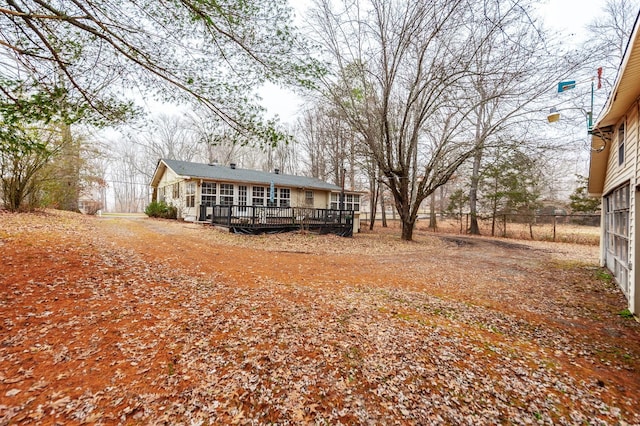 back of house featuring a deck