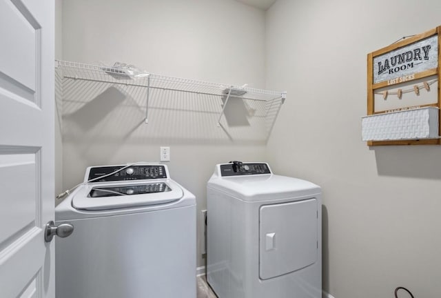 washroom with washer and dryer and laundry area