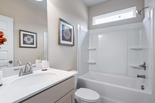 bathroom with toilet, washtub / shower combination, and vanity