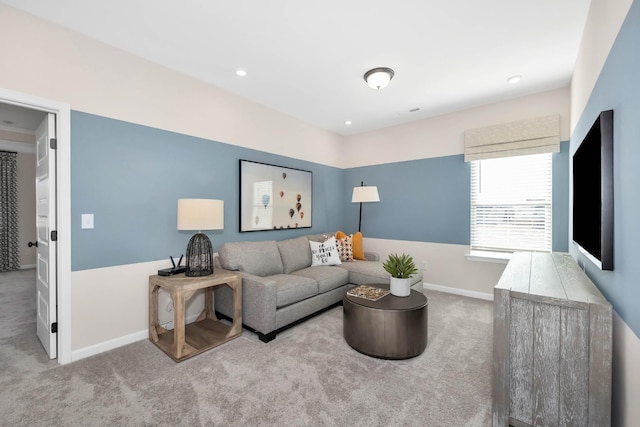 living area featuring recessed lighting, light colored carpet, and baseboards