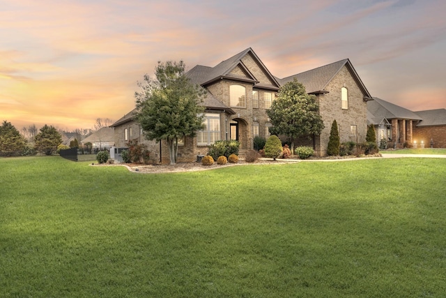 view of front of house with a yard