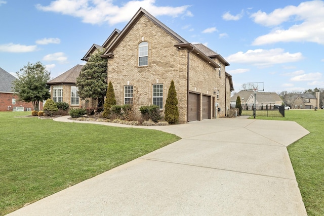 view of side of property featuring a garage and a yard