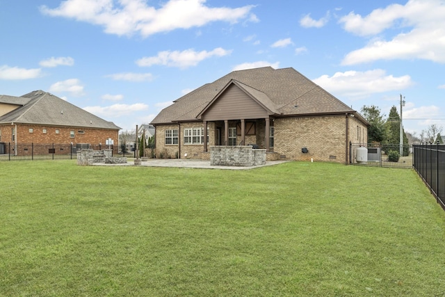 back of house featuring a patio and a lawn