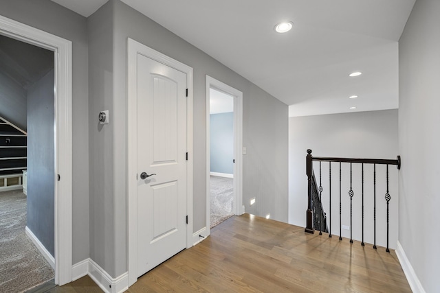 corridor featuring hardwood / wood-style flooring